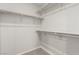 Walk-in closet with shelving and neutral carpet at 6443 Burlap Ct, Las Vegas, NV 89122