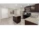 Kitchen boasts granite countertops, stainless appliances, and a center island at 6443 Burlap Ct, Las Vegas, NV 89122