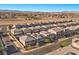 Wide aerial view of a well-planned community with modern homes, streets, and landscaping at 6618 Tangled Vines Ave, Las Vegas, NV 89139