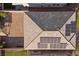An aerial view reveals a detailed roof with solar panels and a neatly bricked driveway at 6618 Tangled Vines Ave, Las Vegas, NV 89139