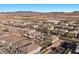 Expansive aerial view featuring an organized community with modern homes and lush landscaping at 6618 Tangled Vines Ave, Las Vegas, NV 89139