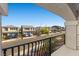 Balcony overlooks the street and nearby homes; features wrought iron railing at 6618 Tangled Vines Ave, Las Vegas, NV 89139