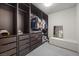 Large walk-in closet with built-in shelving and drawers at 6618 Tangled Vines Ave, Las Vegas, NV 89139