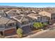 Beautiful two story home featuring a solar panel roof, gray stucco, and manicured landscaping at 6618 Tangled Vines Ave, Las Vegas, NV 89139