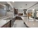 Well-equipped kitchen with stainless steel appliances and a large island with bar seating at 6618 Tangled Vines Ave, Las Vegas, NV 89139