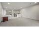 Open loft with gray carpet, light gray walls and a dark brown wood night stand at 6618 Tangled Vines Ave, Las Vegas, NV 89139