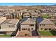 View of backyard including a patio, artificial grass, and stucco exterior, with mountain views at 6618 Tangled Vines Ave, Las Vegas, NV 89139