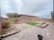Private backyard features custom hardscape, a small lawn, and mature landscaping at 6946 Motley Rd, Las Vegas, NV 89178