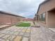 Paver patio and synthetic lawn in this backyard at 6946 Motley Rd, Las Vegas, NV 89178