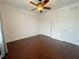 Bedroom with hardwood floors, ceiling fan, and closet at 6946 Motley Rd, Las Vegas, NV 89178
