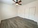 Bedroom with new floors, closet, and ceiling fan at 6946 Motley Rd, Las Vegas, NV 89178
