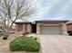 Inviting single-story home with a paver driveway, desert landscaping, and a charming, covered entry at 6946 Motley Rd, Las Vegas, NV 89178