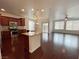 Open kitchen with granite countertops, stainless steel appliances, and a large island at 6946 Motley Rd, Las Vegas, NV 89178