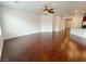 Open living space with hardwood floors, ceiling fan, and adjacent to the kitchen at 6946 Motley Rd, Las Vegas, NV 89178