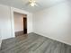 Open room featuring hardwood floors and neutral-colored walls at 6946 Motley Rd, Las Vegas, NV 89178