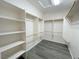 Walk-in closet with ample shelving and modern gray floors at 6946 Motley Rd, Las Vegas, NV 89178