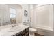 Bright bathroom featuring a shower-tub combination and modern vanity at 715 Orange Plume Walk, Henderson, NV 89011