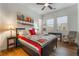 Cozy bedroom featuring hardwood floors, ceiling fan and a basketball themed quilt at 715 Orange Plume Walk, Henderson, NV 89011