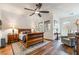 Primary bedroom features a ceiling fan, hardwood floors, and windows with blinds at 715 Orange Plume Walk, Henderson, NV 89011
