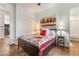 Comfortable bedroom boasting wood floors, ceiling fan and basketball themed quilt at 715 Orange Plume Walk, Henderson, NV 89011