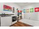 Bright laundry room with front load washer/dryer and yarn for hobbies/crafts at 715 Orange Plume Walk, Henderson, NV 89011