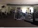 A gym filled with exercise equipment and mirrored walls at 725 N Royal Crest Cir # 228, Las Vegas, NV 89169