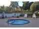 Relaxing hot tub area near the tennis court, perfect for unwinding at 725 N Royal Crest Cir # 228, Las Vegas, NV 89169