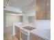 Updated kitchen open to the living area with modern appliances and sleek cabinetry at 725 N Royal Crest Cir # 228, Las Vegas, NV 89169