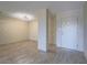 Open concept living room featuring updated floors and a minimalist modern design aesthetic at 725 N Royal Crest Cir # 228, Las Vegas, NV 89169