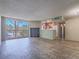 Bright living room with wood floors, a large window, and an adjacent kitchen at 725 N Royal Crest Cir # 228, Las Vegas, NV 89169