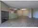 Open concept living room adjacent to the updated kitchen with modern floors and lighting at 725 N Royal Crest Cir # 228, Las Vegas, NV 89169