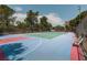 Well-maintained community tennis court with colorful playing surface and landscaping at 725 N Royal Crest Cir # 228, Las Vegas, NV 89169