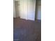 This bedroom features plush carpeting and a closet with white sliding doors for optimal storage at 7290 Sheared Cliff Ln # 102, Las Vegas, NV 89149