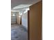 This garage features a white door, cabinetry, and bare concrete floors at 7290 Sheared Cliff Ln # 102, Las Vegas, NV 89149