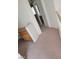 Hallway featuring neutral walls, carpeted floors, and wood trim at 7290 Sheared Cliff Ln # 102, Las Vegas, NV 89149