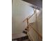 Staircase with carpeted steps and wood railing at 7290 Sheared Cliff Ln # 102, Las Vegas, NV 89149