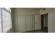 Neutral bedroom with vinyl floor, closet, and window at 75 N Valle Verde Dr # 2121, Henderson, NV 89074