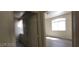 View of a bedroom with vinyl floor, showing the arch window at 75 N Valle Verde Dr # 2121, Henderson, NV 89074