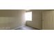 Cozy bedroom featuring a window for natural light and a door, enhanced by wood-look flooring at 75 N Valle Verde Dr # 2121, Henderson, NV 89074