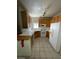 Well-lit kitchen with white appliances and tiled floors at 75 N Valle Verde Dr # 2121, Henderson, NV 89074
