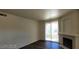 Comfortable living room with a fireplace and access to the balcony at 75 N Valle Verde Dr # 2121, Henderson, NV 89074