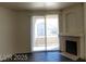 Bright living room with fireplace and sliding glass doors to balcony at 75 N Valle Verde Dr # 2121, Henderson, NV 89074