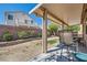 Inviting backyard with a covered patio and well-maintained landscaping, creating a serene outdoor oasis at 7515 Splashing Rock Dr, Las Vegas, NV 89131