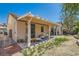 Outdoor patio area perfect for entertaining, surrounded by a well-maintained yard at 7515 Splashing Rock Dr, Las Vegas, NV 89131