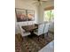 Charming dining space with a rustic table, comfortable seating, and delightful artwork at 7515 Splashing Rock Dr, Las Vegas, NV 89131