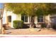 Inviting single-story home with well-maintained landscaping and mature shade trees at 7515 Splashing Rock Dr, Las Vegas, NV 89131