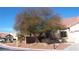 Residential homes boast desert landscaping and mature trees in a quiet setting at 7515 Splashing Rock Dr, Las Vegas, NV 89131