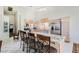 Spacious kitchen with granite counters, island with barstool seating, and stainless steel appliances at 7515 Splashing Rock Dr, Las Vegas, NV 89131