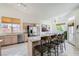 Light and bright kitchen with granite countertops, stainless steel appliances, and barstool seating at 7515 Splashing Rock Dr, Las Vegas, NV 89131