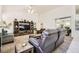 Open living area with vaulted ceilings, plush carpet, and modern furnishings at 7515 Splashing Rock Dr, Las Vegas, NV 89131